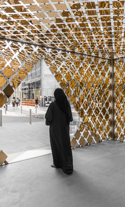  A woman standing in a mosaic structure at one of our venues in Dubai 