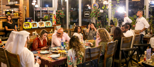 A family having dinner at one of d3's community restaurant