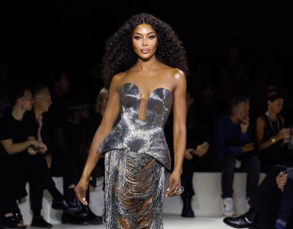 fashion icon Naomi Campbell struts down the show in a stunning silver dress