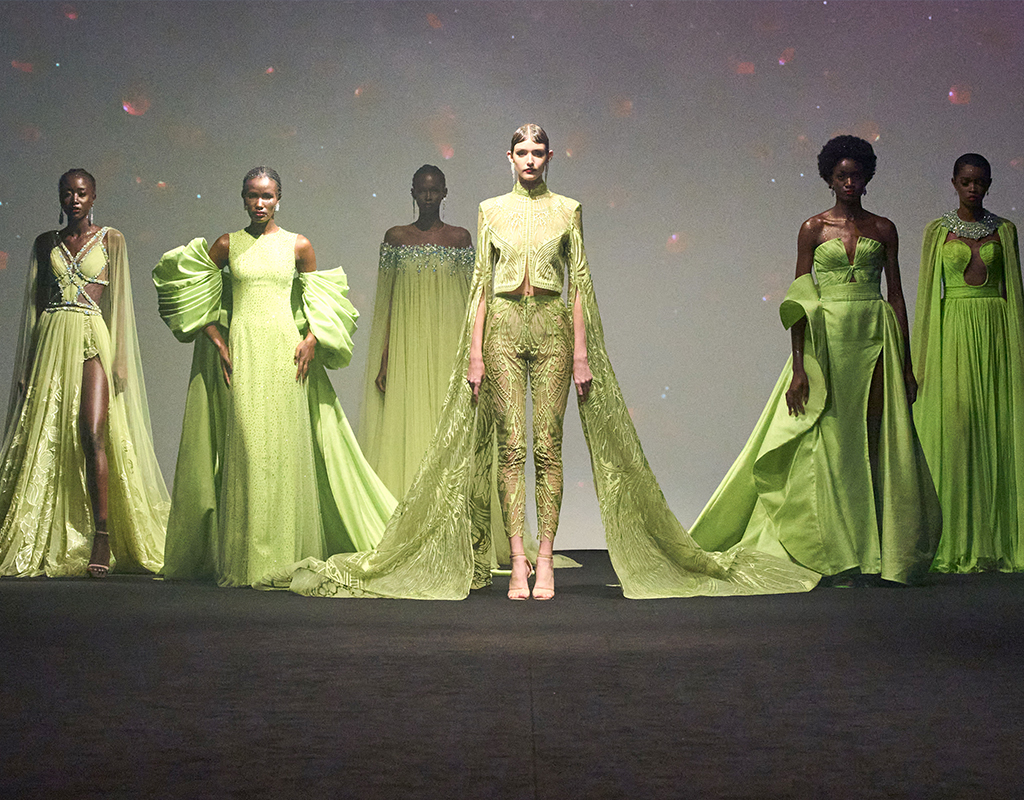 6 female fashion models wearing Light green dresses as an activity on the 7th day of Dubai Fashion Week 