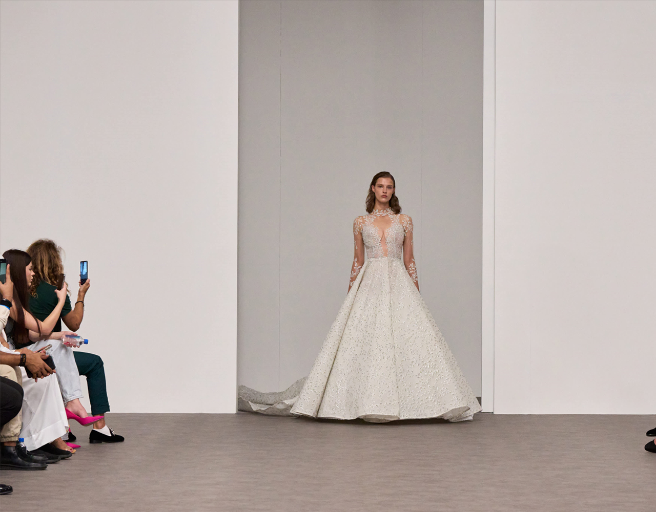 Model showcasing a white gown