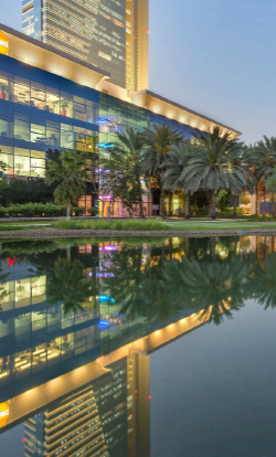  Evening view of Dubai Outsource City, offering outsourcing services' offices in Dubai