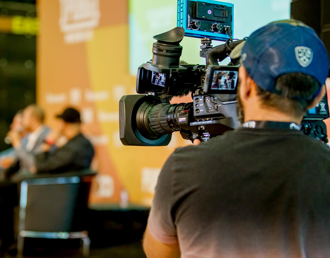 A man recording an interview on camera at Dubai Studio City 