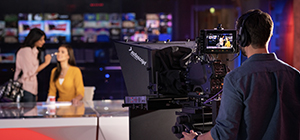 A woman getting a mid-shoot makeup touchup done, at Dubai Studio City